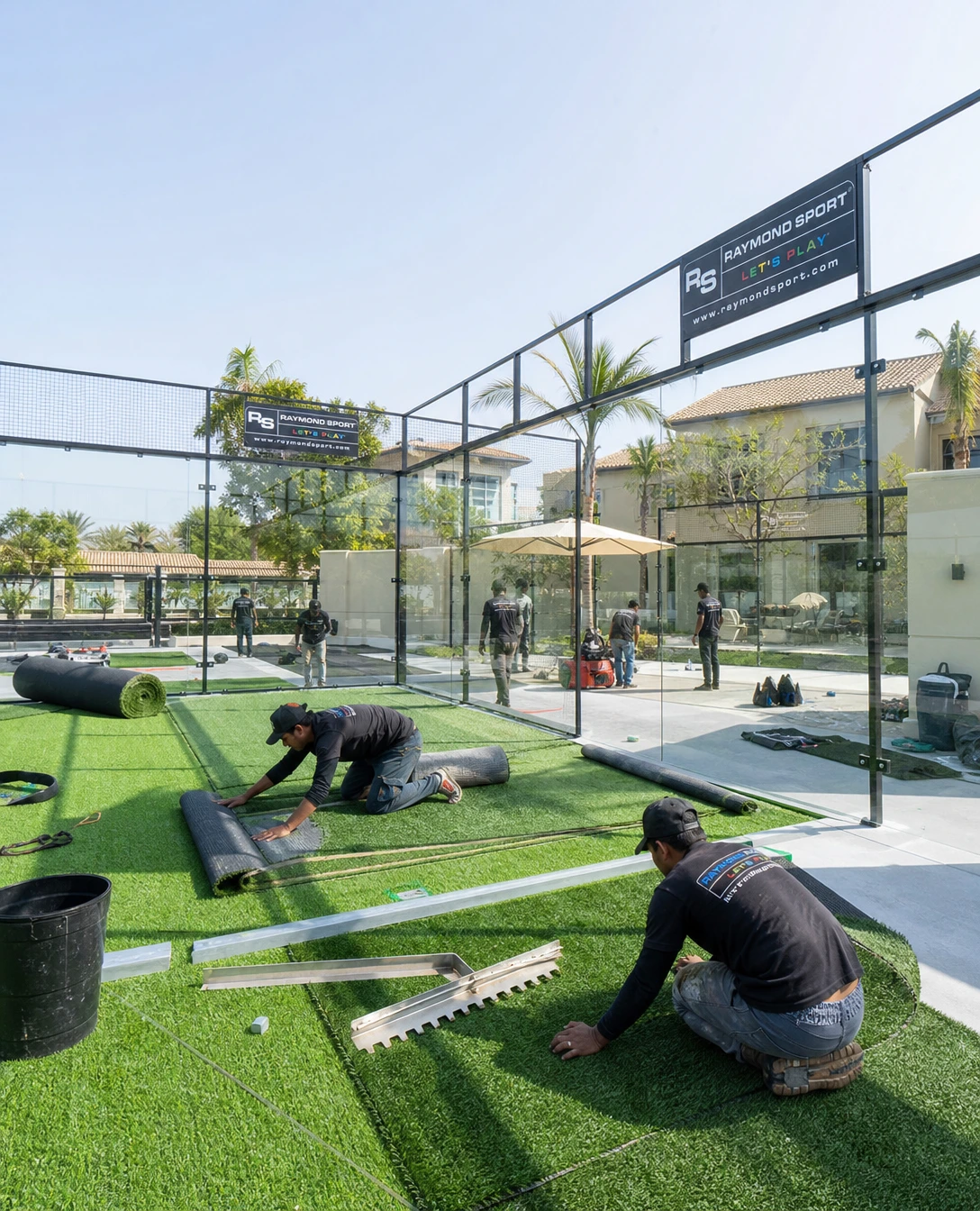 Monofilament artificial turf being installed and infilled on a padel court in the UAE by Raymond Sport